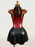 Back view of black and red faux leather halter mini dress with open back and neck bow