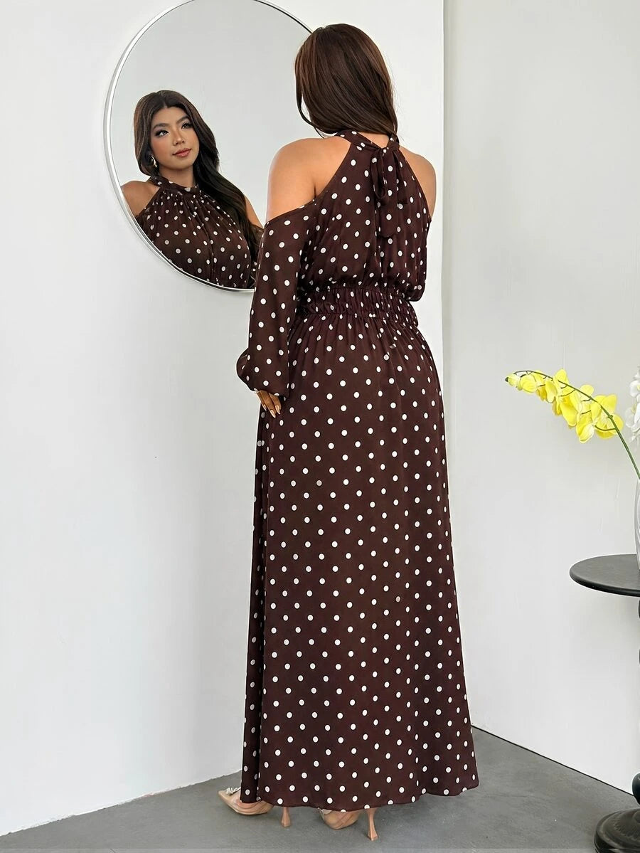 Back view of brown polka-dot halter tie-back maxi dress