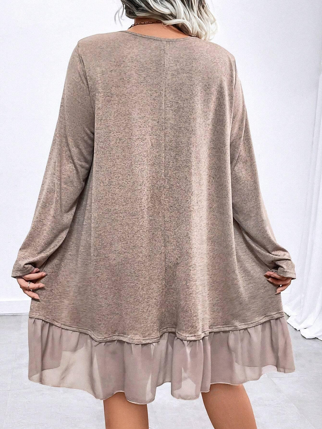 Elevate your wardrobe with our Chic & Comfortable Plus Size Dress. Featuring a solid color and crew neck design, this dress exudes effortless style and sophistication. The ruffle hem adds a touch of femininity, making this dress perfect for any occasion. Experience comfort and style in one elegant piece.