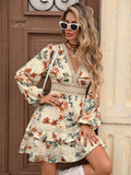 Front view of apricot floral boho mini dress with deep V neckline, floral print and lace waist detail