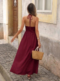Back view of burgundy boho halter maxi dress with open back and halter tie