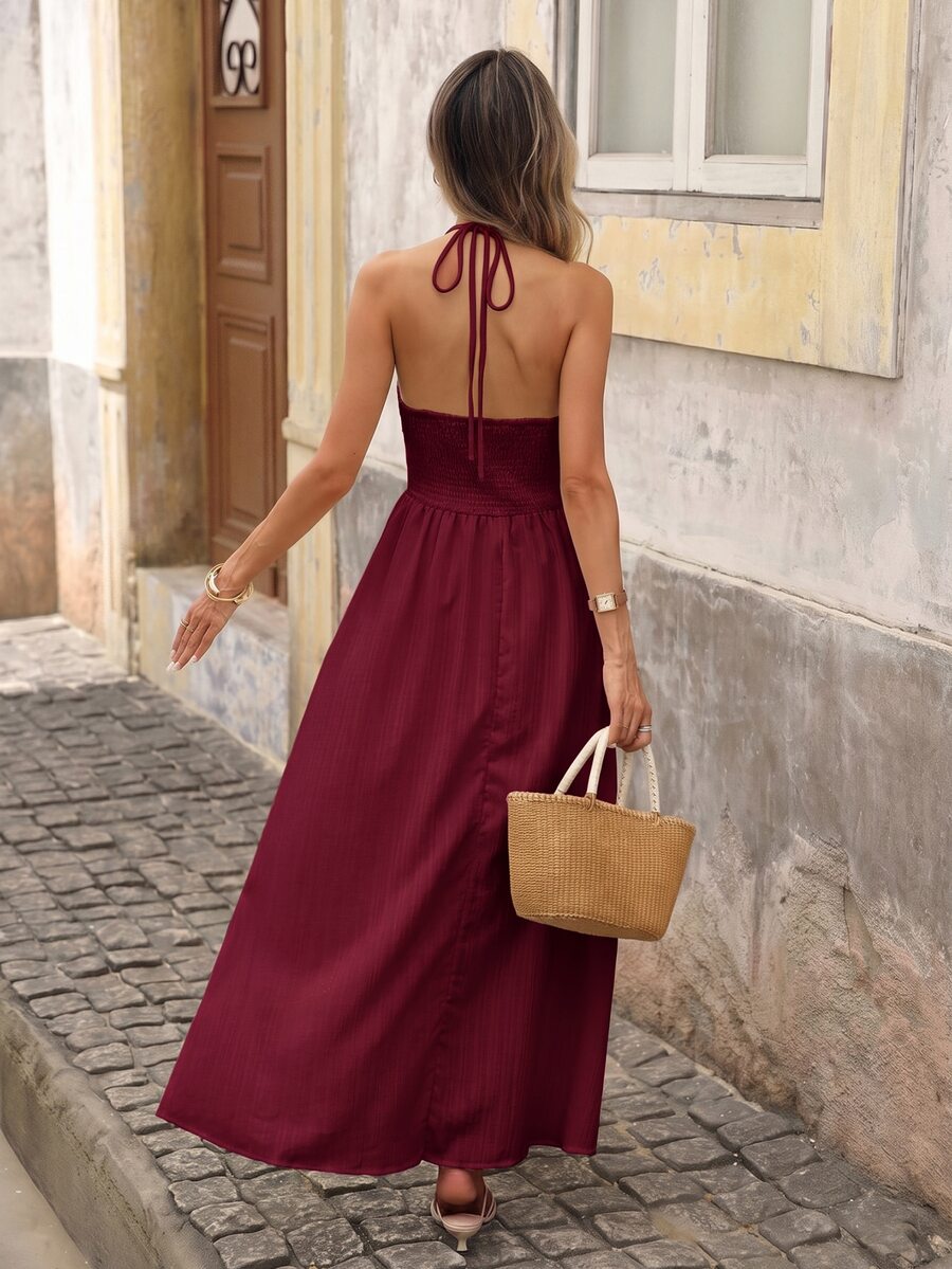 Back view of burgundy boho halter maxi dress with open back and halter tie