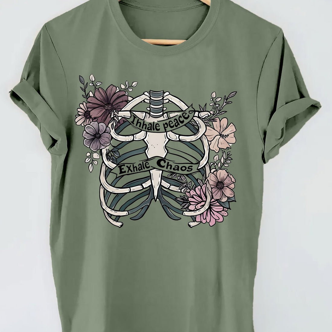 Introducing our Skull and Floral Fusion top, perfect for a casual look with short sleeves. Embrace your edgy side with the skull design while still staying feminine with the floral fusion. This top is a unique balance of style and comfort, making it a must-have for any fashion-forward woman.