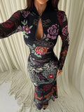 Close view of colorful floral print and keyhole front on black mermaid gown