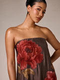 Close view of brown satin bodice with large red rose embroidery at strapless neckline