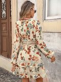 Back view of apricot floral boho mini dress with lace-trimmed waist and tiered ruffle skirt