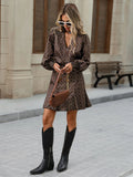 Full view of geometric print V-neck short dress with shirred cuffs