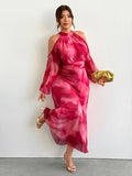 Front view of pink tie-dye plus size halter cold-shoulder maxi dress with bishop sleeves