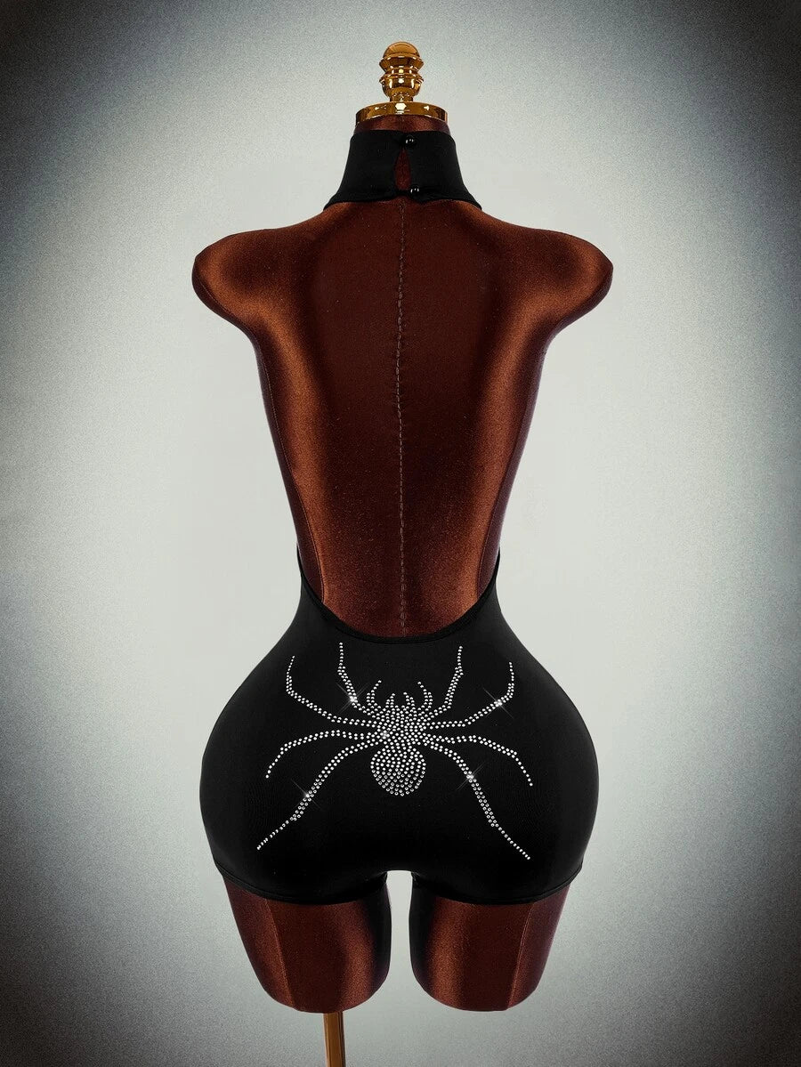 Back view of black backless unitard with rhinestone spider and center zipper