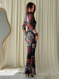 Side view of black floral dragon-print mermaid maxi dress with sheer long sleeves