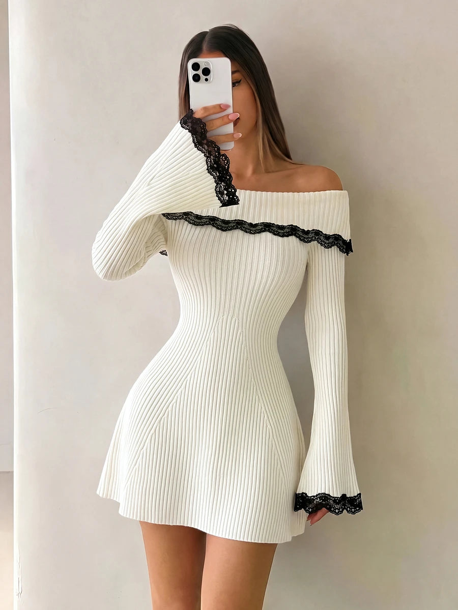 Mirror view showing fitted ivory sweater dress and lace-edged flared sleeves