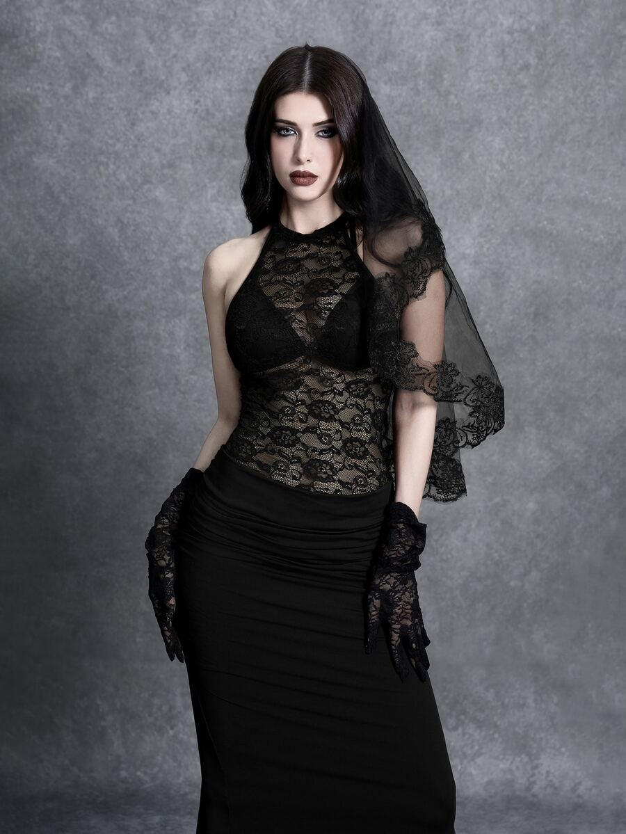 Close front view of black floral lace bodice and ruched maxi skirt