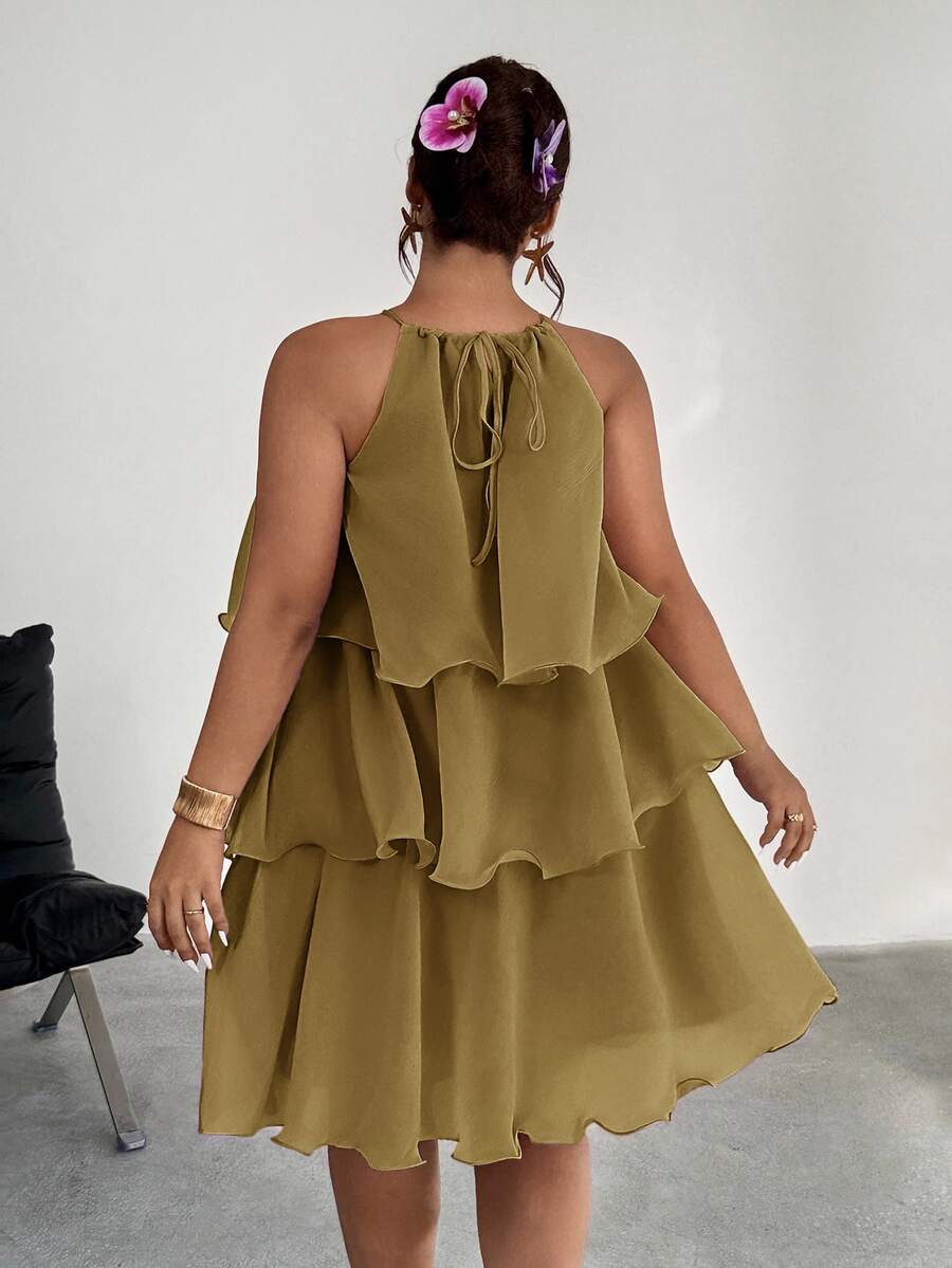 Front view of olive tiered halter dress with ruffled A-line skirt