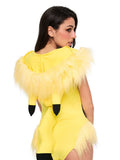 Close-up view of yellow anime bodysuit cartoon print and faux fur patchwork