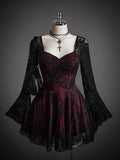 Front view of burgundy black lace dress with corset seams flared skirt and bell sleeves