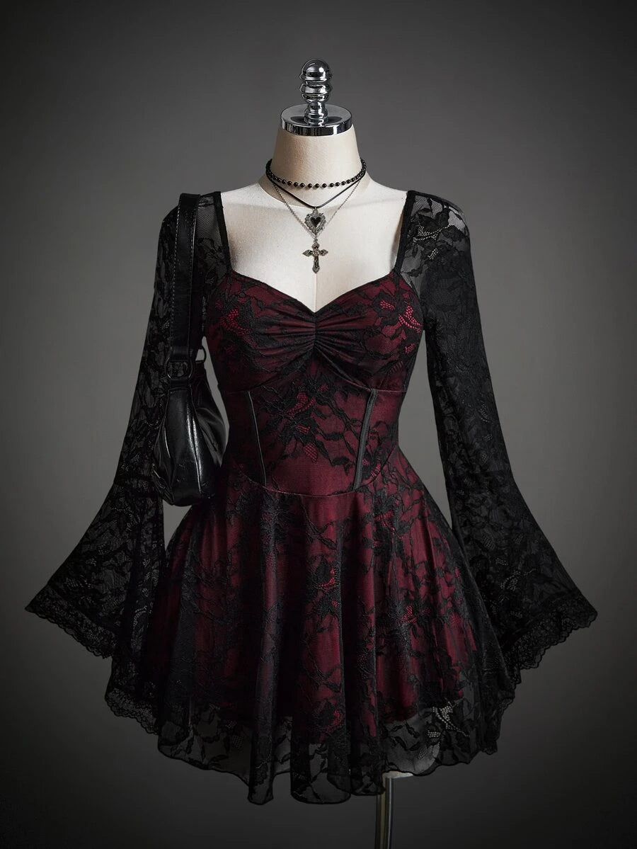 Front view of burgundy black lace dress with corset seams flared skirt and bell sleeves