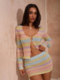 Close detail of ring-button front cutout on pastel striped knit cardigan and mini skirt set