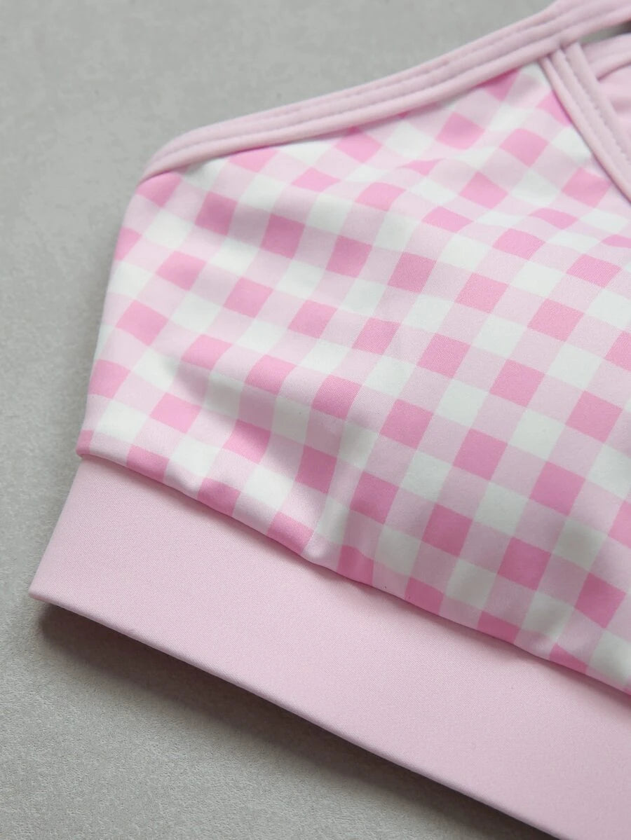 Detail of adjustable spaghetti straps and lined pink check sports top