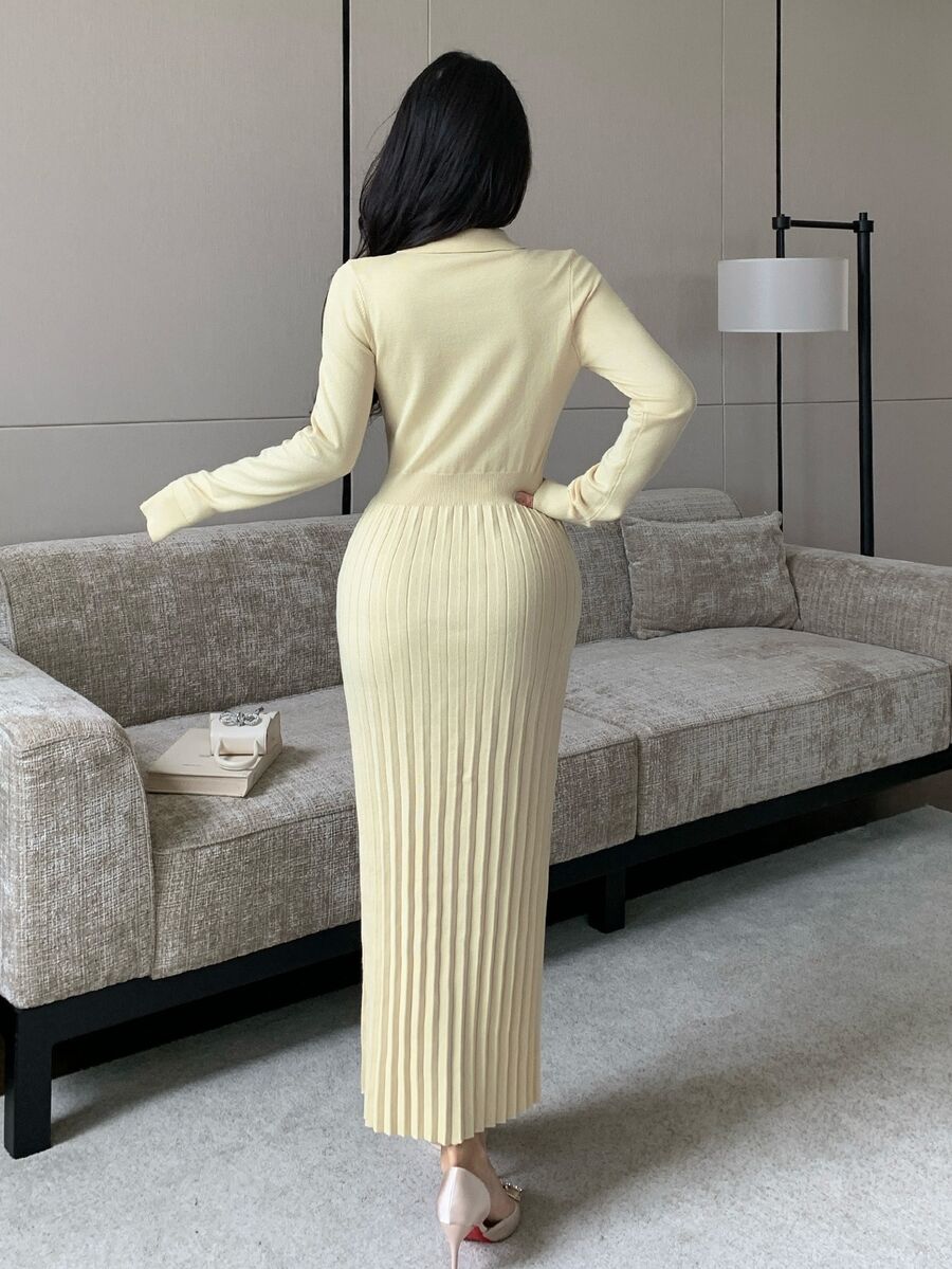 Front view of a model wearing an ivory apricot polo-collar knit dress with button placket, patterned waist and pleated long skirt