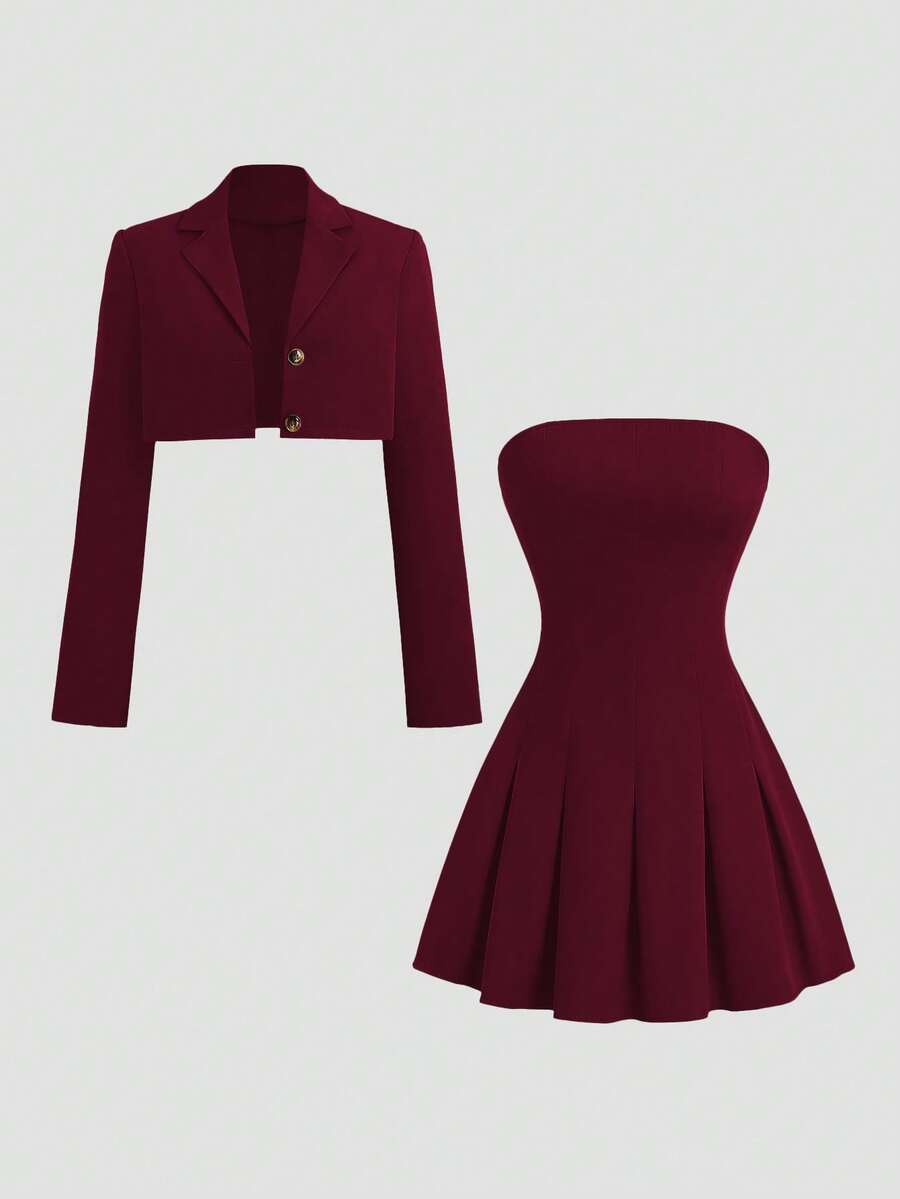 Front view of black cropped blazer and strapless pleated dress two piece set