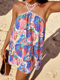Front high-angle view of blue pink botanical mini dress with crossed straps