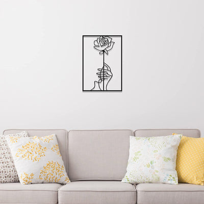 This sleek metal wall art features a simple silhouette of a female body in an abstract line design. An elegant home decor choice, this sign makes an ideal hanging piece to show off the perfect combination of style and beauty.