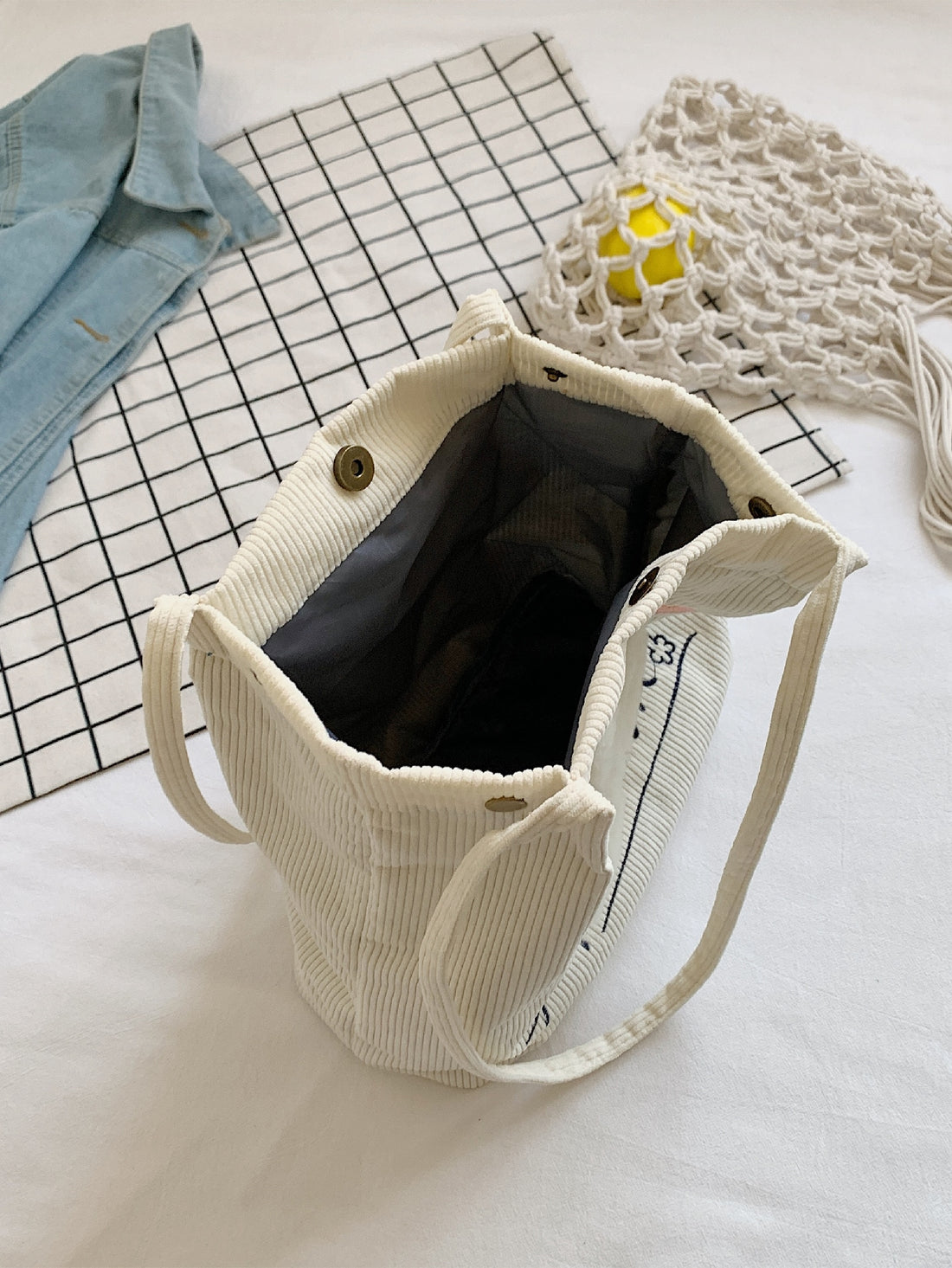 Introducing our Fun and Functional Shopper <a href="https://canaryhouze.com/collections/canvas-tote-bags" target="_blank" rel="noopener">Bag</a>! With its unique snap button closure and playful letter cartoon graphic, this bag is both functional and stylish. Made for everyday use, it easily holds all your essentials while making a statement. Perfect for the fun-loving and fashion-forward individual.