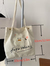 Fun and Functional: Letter Cartoon Graphic Snap Button Shopper Bag