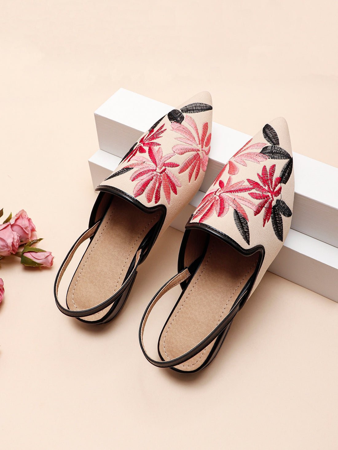 Elevate your style with Chic &amp; Floral's Women's Embroidered Point Toe Slingback Flats. The elegant embroidered design adds a touch of sophistication to any outfit, while the slingback feature ensures a comfortable and secure fit. Step out in confidence and class with these chic flats.