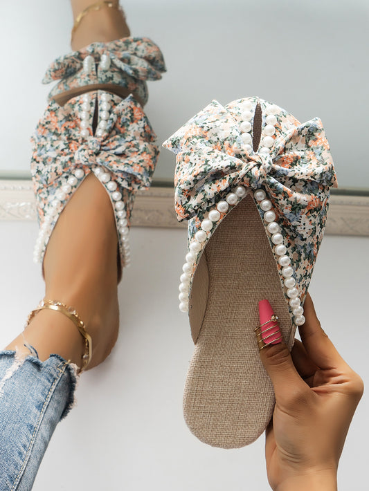 These stylish mule flats bring together fashion and comfort with an eye-catching multi-colored print. The chic bow and faux pearl details add a touch of elegance to any <a href="https://canaryhouze.com/collections/women-canvas-shoes" target="_blank" rel="noopener">outfit</a>. Walk confidently with style in these versatile flats.