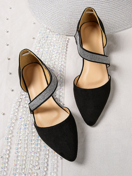 Elevate your style with our Sparkling Rhinestone Strappy Flats. Made with black suedette for a touch of elegance, the contrast color adds a fashionable twist to these <a href="https://canaryhouze.com/collections/women-canvas-shoes" target="_blank" rel="noopener">shoes</a>. With sparkling rhinestones for some subtle glam, these flats are perfect for any occasion.