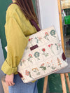 Introducing our Floral Graphic Canvas Shoulder Tote Bag, your perfect companion for a stylish spring adventure! Crafted with a chic floral design and durable canvas material, this tote is both fashionable and functional. With plenty of room for all your essentials, you'll be ready to take on any adventure in style.