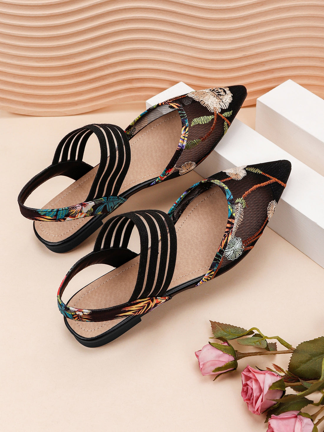 Add a touch of elegance to your wardrobe with our Chic and Sophisticated: Floral Embroidered Ankle Strap Flats. The chic and sophisticated design, featuring delicate floral embroidery, will elevate any outfit. Stay comfortable with the ankle strap and enjoy the classic style these flats offer.