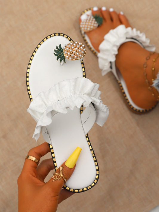 Expertly crafted with a chic ruffled trim and adorned with delicate white pearls, our Pineapple Dreams sandals will add a touch of elegance to any outfit. These flat sandals offer a comfortable fit and versatile style, making them the perfect addition to your summer wardrobe.