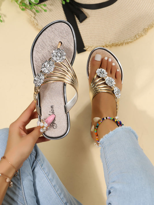 "Complete your summer wardrobe with our Fashionable Rhinestone Flower Flip Flops for Women. These essential sandals offer a touch of glamour with rhinestone embellishments, while still providing comfort and durability for all your vacation adventures. Upgrade your style and enjoy the warm weather in fashion."