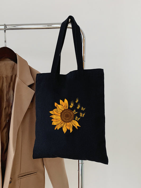 Elevate your back-to-school game with our Sunflower and Butterfly Pattern Shopper Bag - the ultimate essential for college or high school students. This stylish bag features a durable design and a beautiful floral and butterfly print, making it both practical and fashionable. Perfect for carrying books, laptops, and more. Upgrade your daily commute with this must-have accessory.