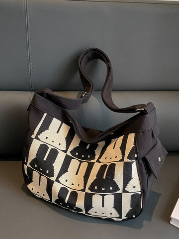 Carry all your essentials in style with our Bunny Decoration Canvas Shoulder <a href="https://canaryhouze.com/collections/canvas-tote-bags" target="_blank" rel="noopener">Bag</a>! With a large capacity, this messenger bag is perfect for students, walking, and festivals. Made with durable canvas and featuring a cute bunny design, it's not only functional but also makes for an ideal gift. Stay organized and look fashionable with our versatile bag.