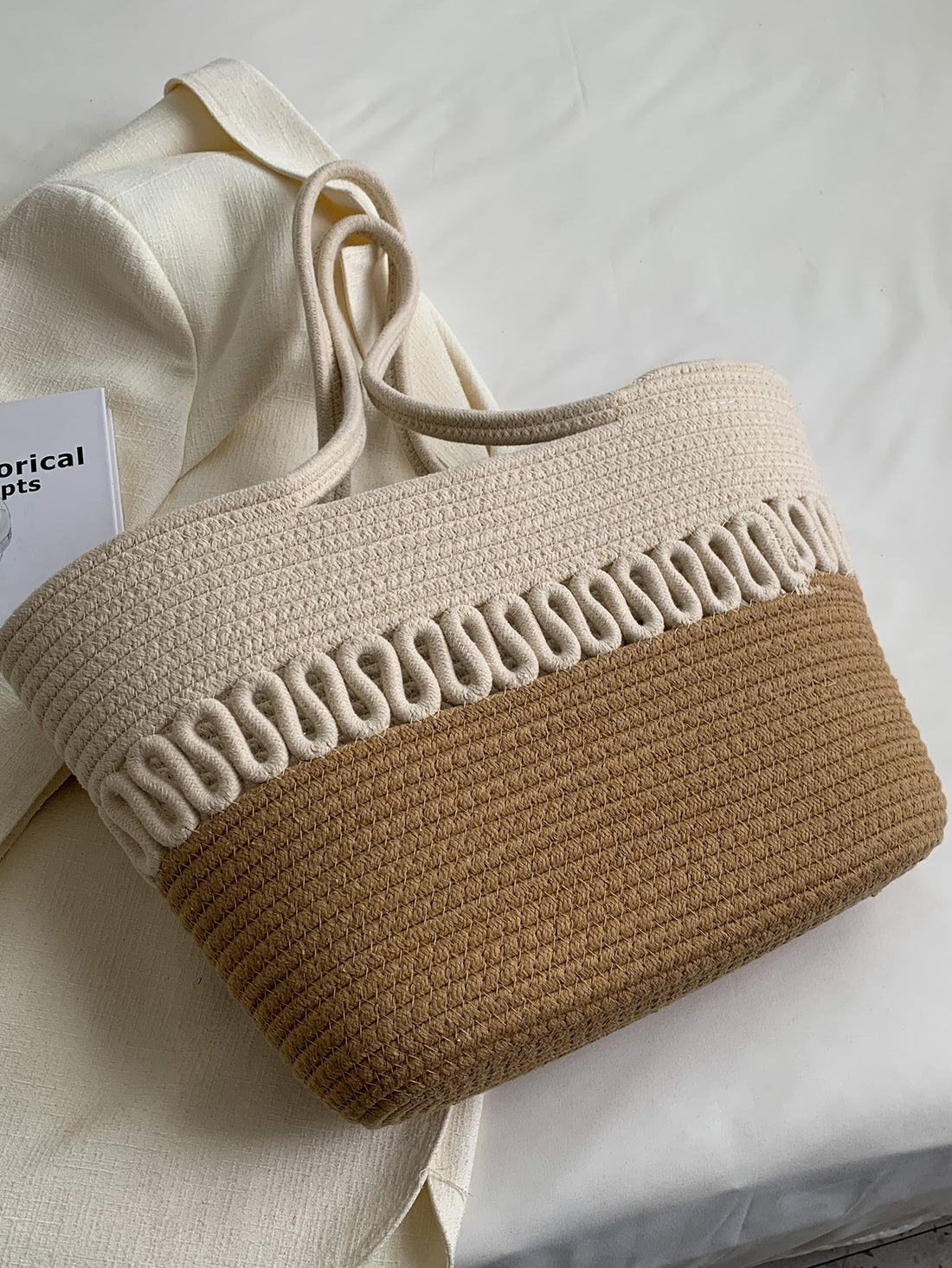 Enhance your beach attire with our Khaki Colorblock Knitting Kits Straw Beach <a href="https://canaryhouze.com/collections/canvas-tote-bags" target="_blank" rel="noopener">Bag</a>. Handmade with a large capacity, it's perfect for a summer holiday or leisure day. Add a touch of style and functionality to your beach essentials.