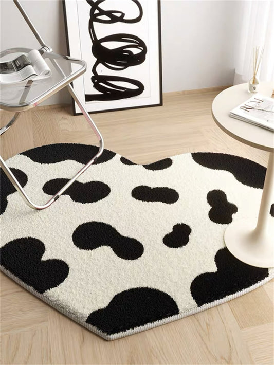 Add some charm to your living room with our Cow Pattern Heart Design Anti-slip Bedroom Rug. The non-slip bottom ensures safety while the soft material provides a cozy touch. The unique cow print and heart design make this rug a stylish addition to any home.