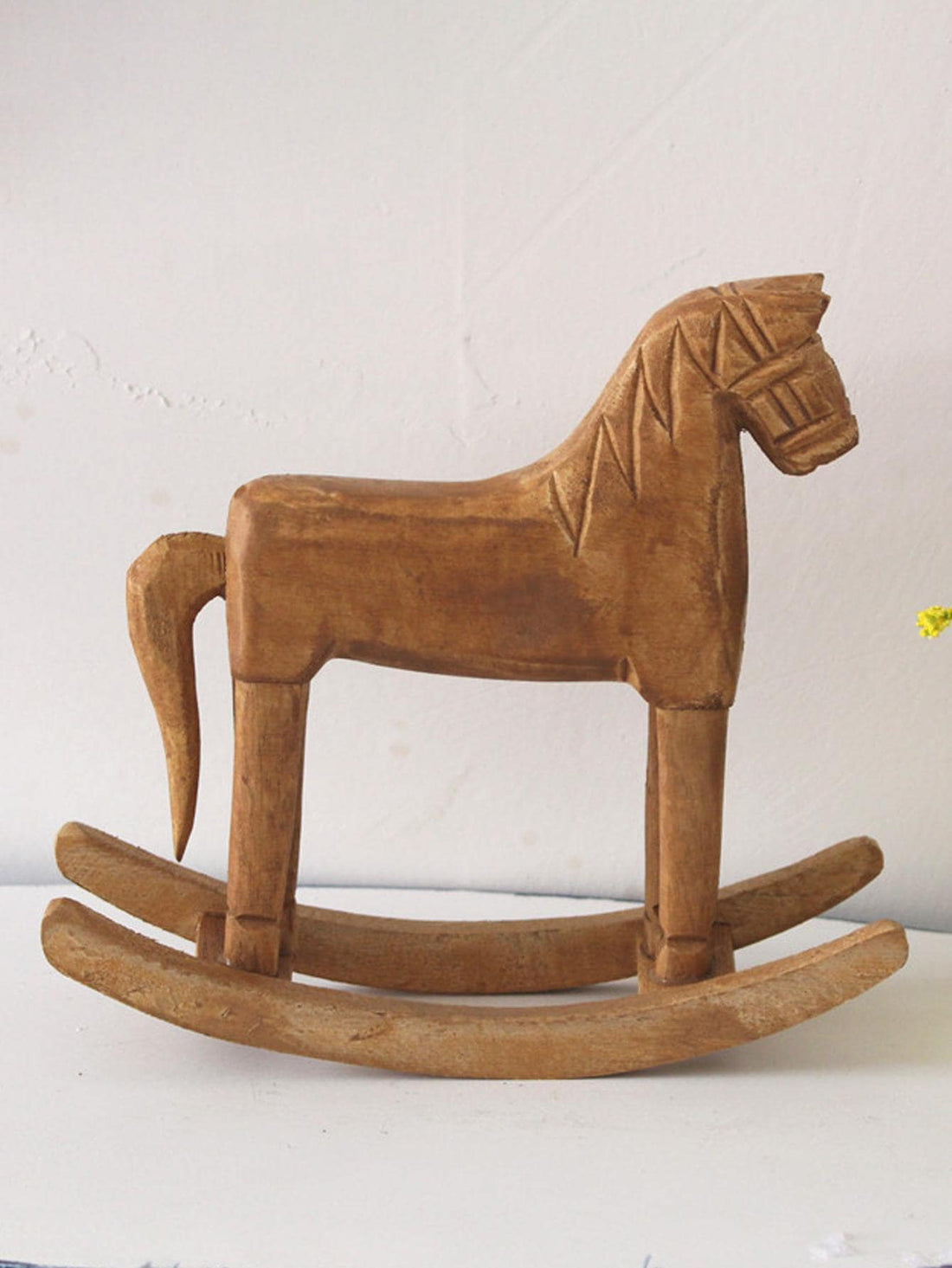 This elegant wooden <a href="https://canaryhouze.com/collections/ornaments" target="_blank" rel="noopener">horse décor</a> is the perfect addition to any stylish home interior. Crafted with precision and attention to detail, this piece exudes sophistication and adds a touch of luxury to any space. Made from high-quality materials, it is not only visually appealing but also durable and long-lasting. Enhance your home's aesthetic with this exquisite decoration.