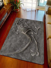 Introduce a touch of prehistoric charm into your home with our Dinosaur Fossil Pattern Rug. Made of modern fabric, this anti-slip floor mat is both functional and stylish. Enjoy a safer household while adding a unique design element. Perfect for dinosaur enthusiasts and modern decor lovers alike.