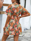 Island Escape: Tropical Print Butterfly Sleeve Dress