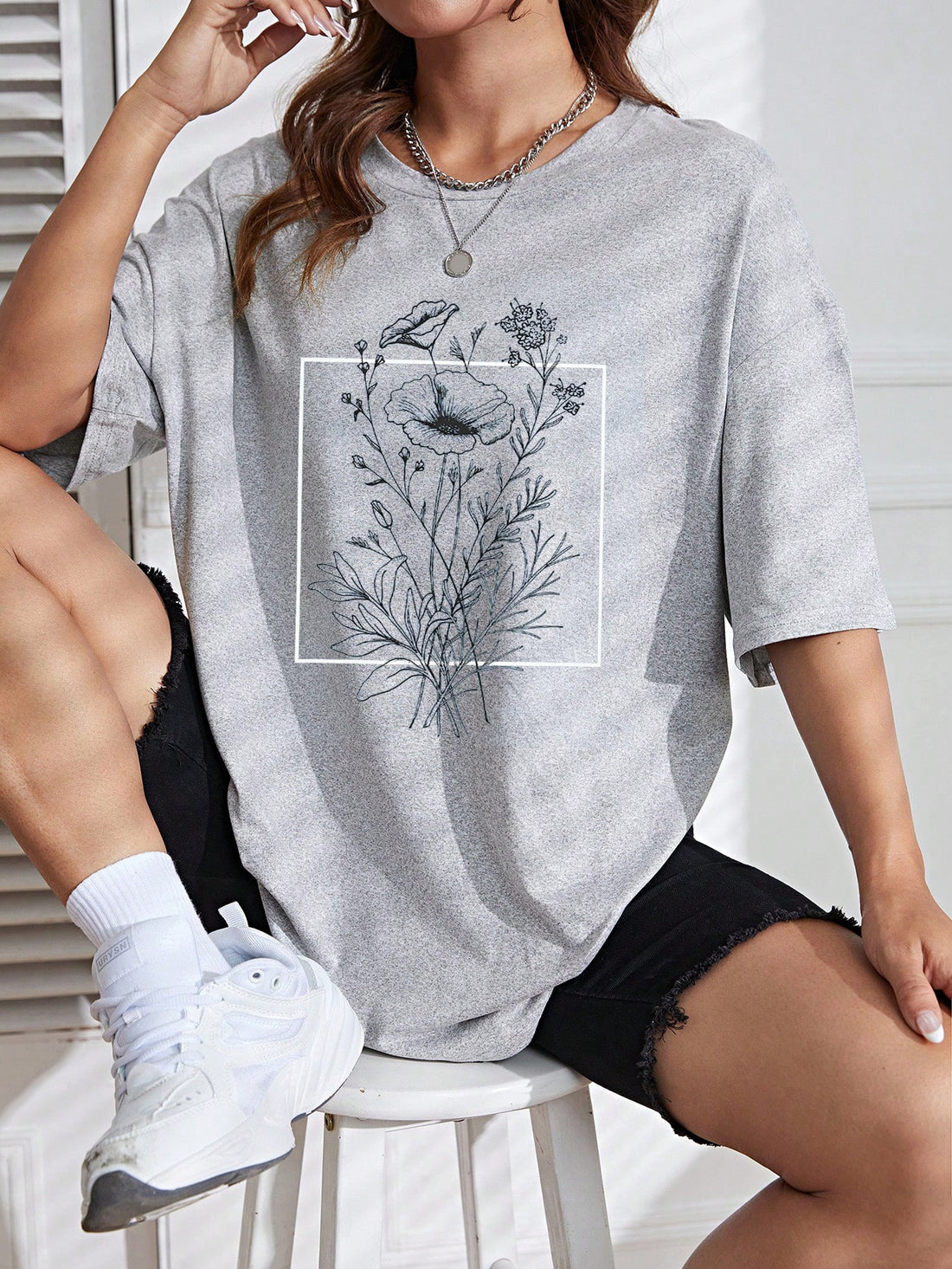 Upgrade your wardrobe with our Chic Floral Print Drop Shoulder Tee! This must-have top combines effortless style with a bold floral print, perfect for any occasion. With its relaxed drop shoulder design, stay comfortable and on-trend. Elevate your look with this chic tee and embrace effortless style.