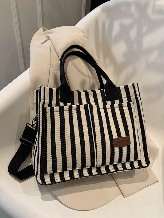 This Chic and Versatile Stripe Pattern <a href="https://canaryhouze.com/collections/canvas-tote-bags" target="_blank" rel="noopener">Tote Bag</a> is designed for women and white-collar workers. Made with a stylish stripe pattern, it is both fashionable and practical. With ample space and a durable design, this tote bag is perfect for everyday use and will elevate any outfit.