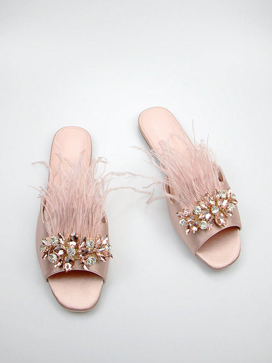 Introducing our Sparkling Satin Baby Pink Sandals, perfect for adding glamour to any woman's wardrobe. With a shimmering satin material and a delicate baby pink color, these sandals will elevate any outfit. Step out in style and comfort with our elegant and sophisticated design.