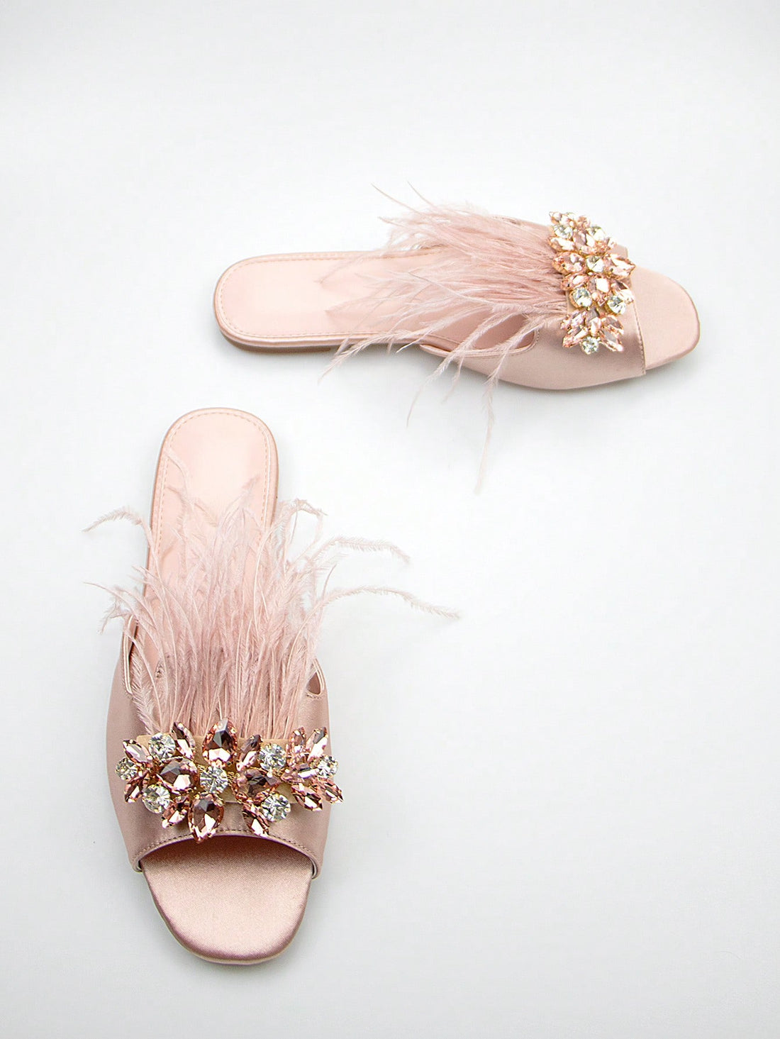 Introducing our Sparkling Satin Baby Pink Sandals, perfect for adding glamour to any woman's wardrobe. With a shimmering satin material and a delicate baby pink color, these sandals will elevate any outfit. Step out in style and comfort with our elegant and sophisticated design.