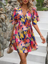 Island Escape: Tropical Print Butterfly Sleeve Dress