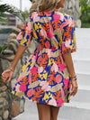 Island Escape: Tropical Print Butterfly Sleeve Dress