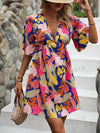 Island Escape: Tropical Print Butterfly Sleeve Dress