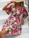 Island Escape: Tropical Print Butterfly Sleeve Dress